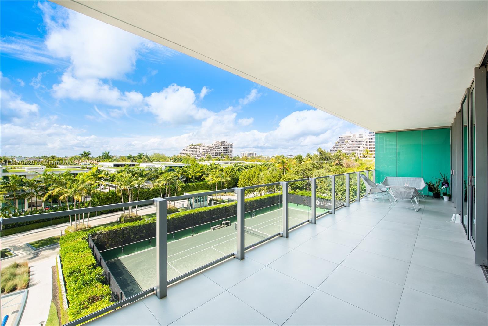 350 Ocean Drive, Unit 403N Key Biscayne, FL 33149 - Photo 50 of 55 a view of a chairs and table in the balcony