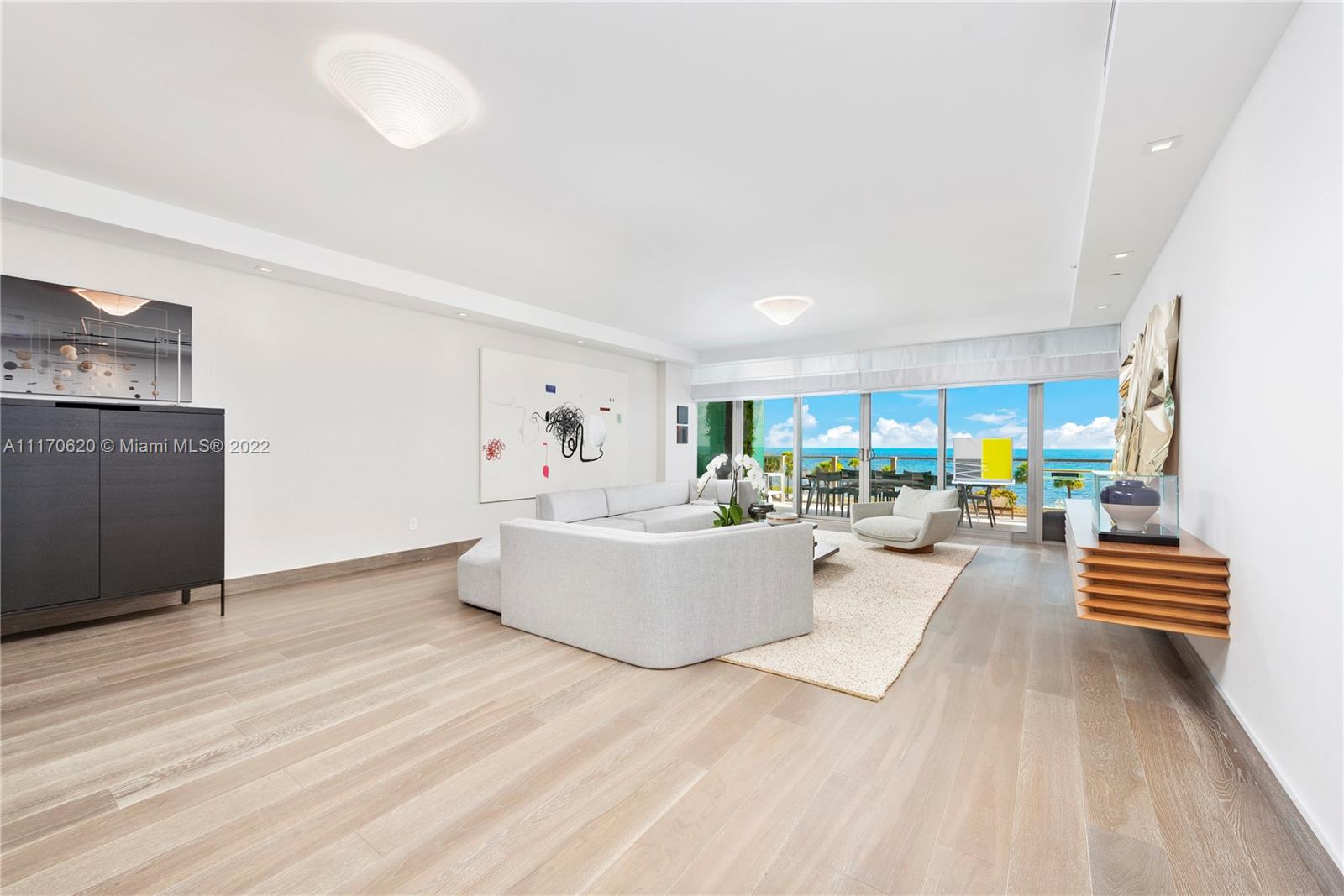 350 Ocean Drive, Unit 403N Key Biscayne, FL 33149 - Photo 5 of 55 a living room with furniture and wooden floor