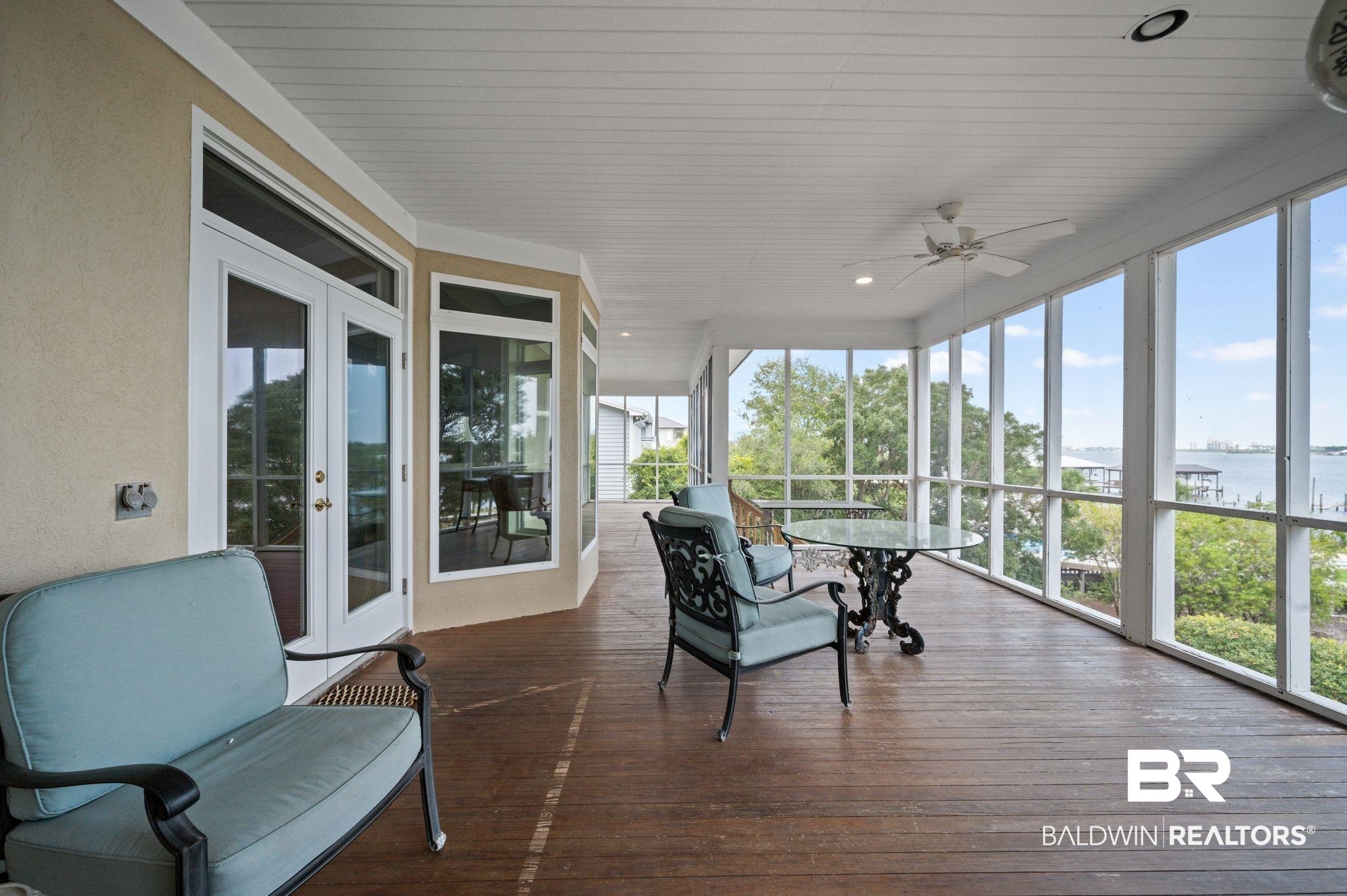 31800 River Road Orange Beach, AL 36561 - Photo 47 of 69 Sunroom / solarium featuring ceiling fan, a water view, and french doors