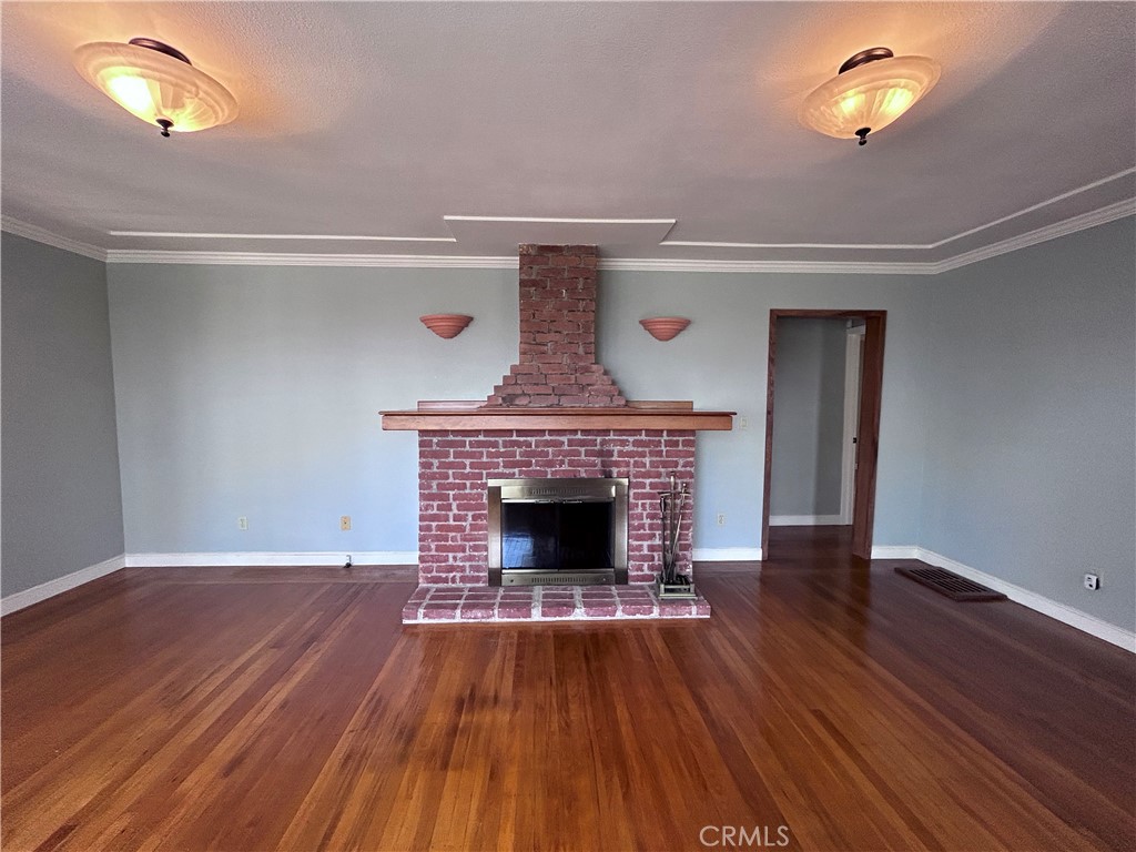 1009 Keith Avenue Berkeley, CA 94708 - Photo 11 of 36 a view of a livingroom with wooden floor and a fireplace