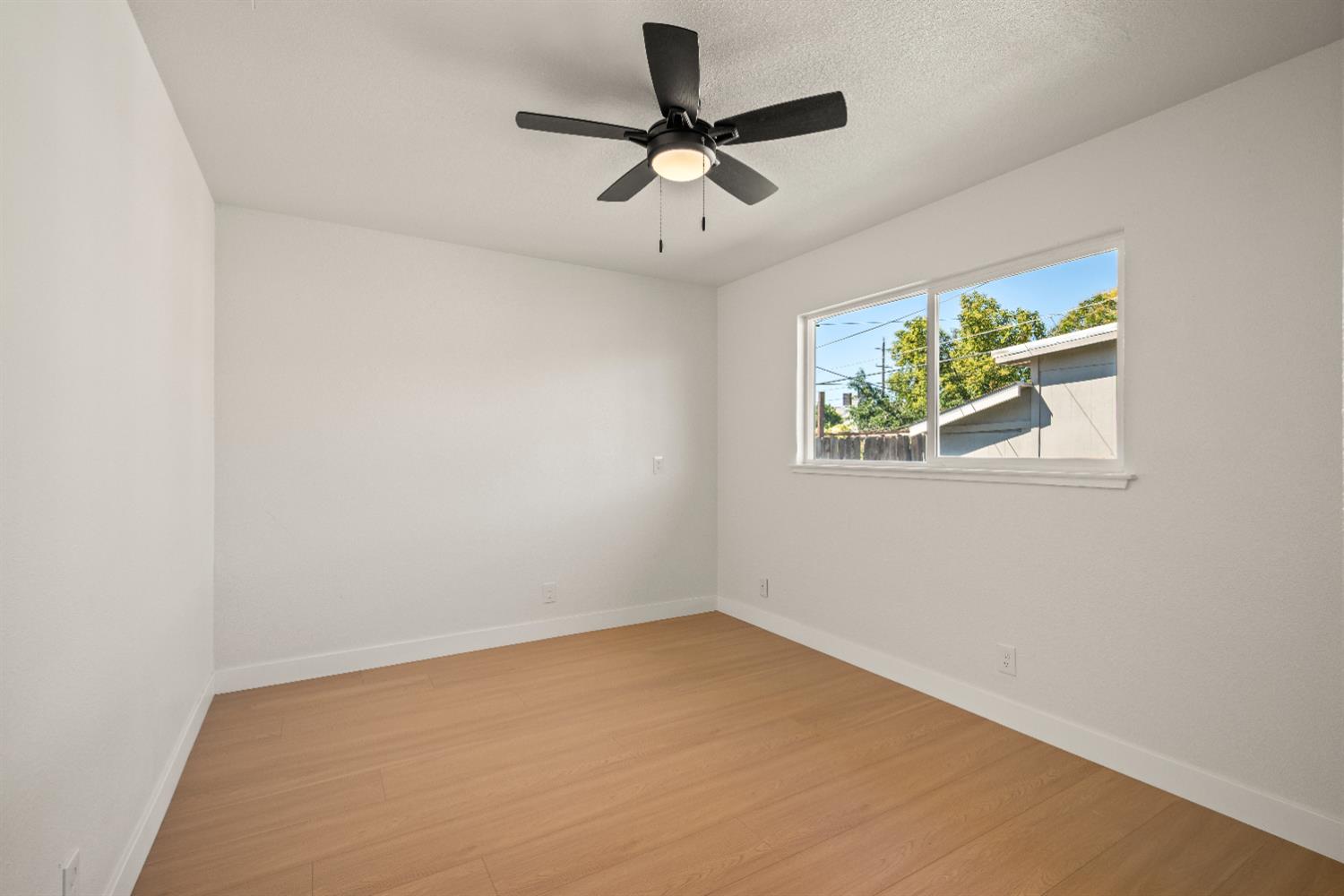 2628 Tronero Way Rancho Cordova, CA 95670 - Photo 12 of 31 an empty room with a window and a ceiling fan