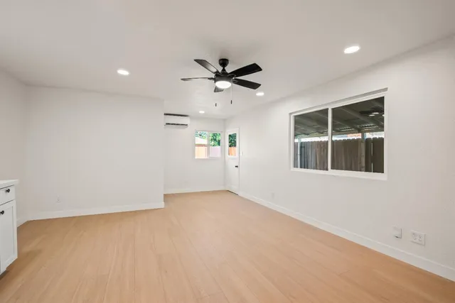 a view of a kitchen with a sink and cabinet