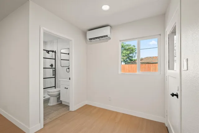 a bathroom with a toilet a sink and a shower