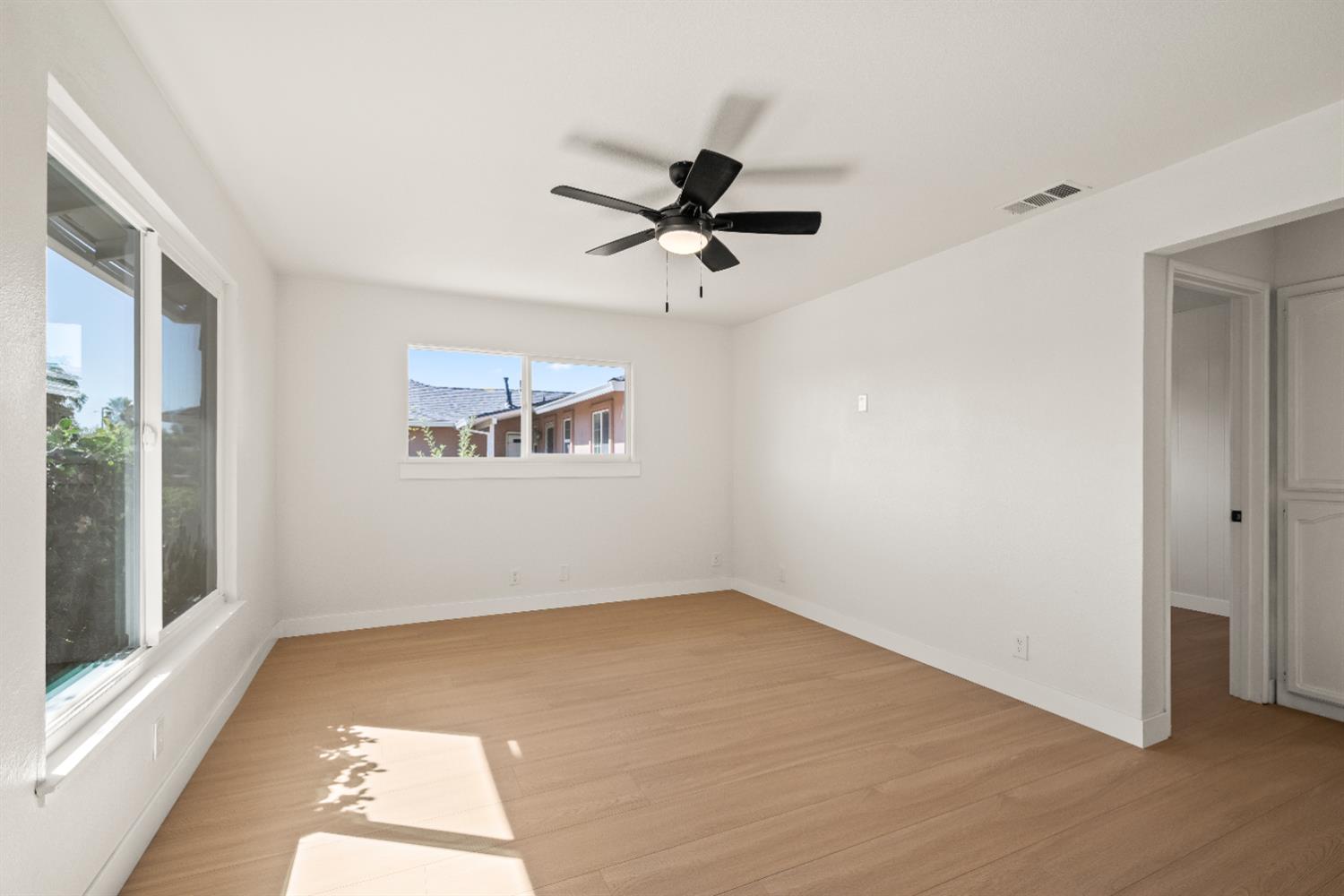 2628 Tronero Way Rancho Cordova, CA 95670 - Photo 3 of 31 wooden floor in an empty room with a window