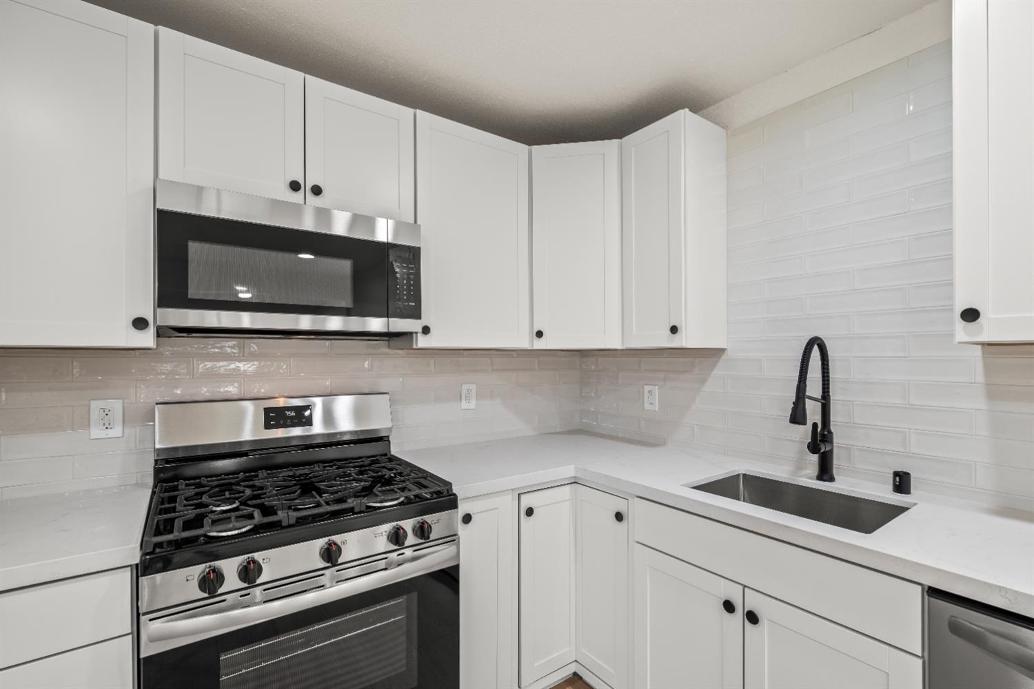 2628 Tronero Way Rancho Cordova, CA 95670 - Photo 9 of 31 a kitchen with white cabinets and appliances