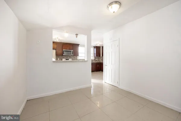 a view of a kitchen with a sink and a microwave