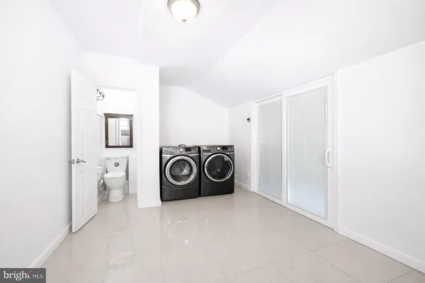 a utility room with dryer and washer