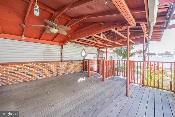 a view of porch with wooden floor
