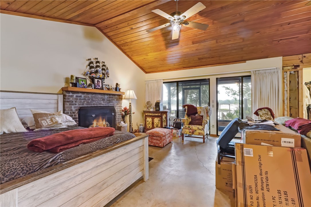 96270 Willyoung Road Yulee, FL 32097 - Photo 7 of 9 a living room with furniture and a fireplace