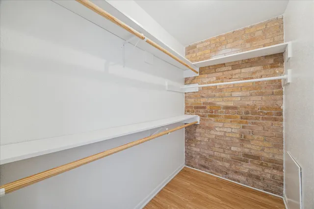 a view of an empty walk in closet