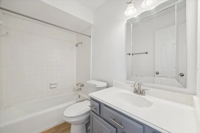 a bathroom with a sink toilet tub and shower