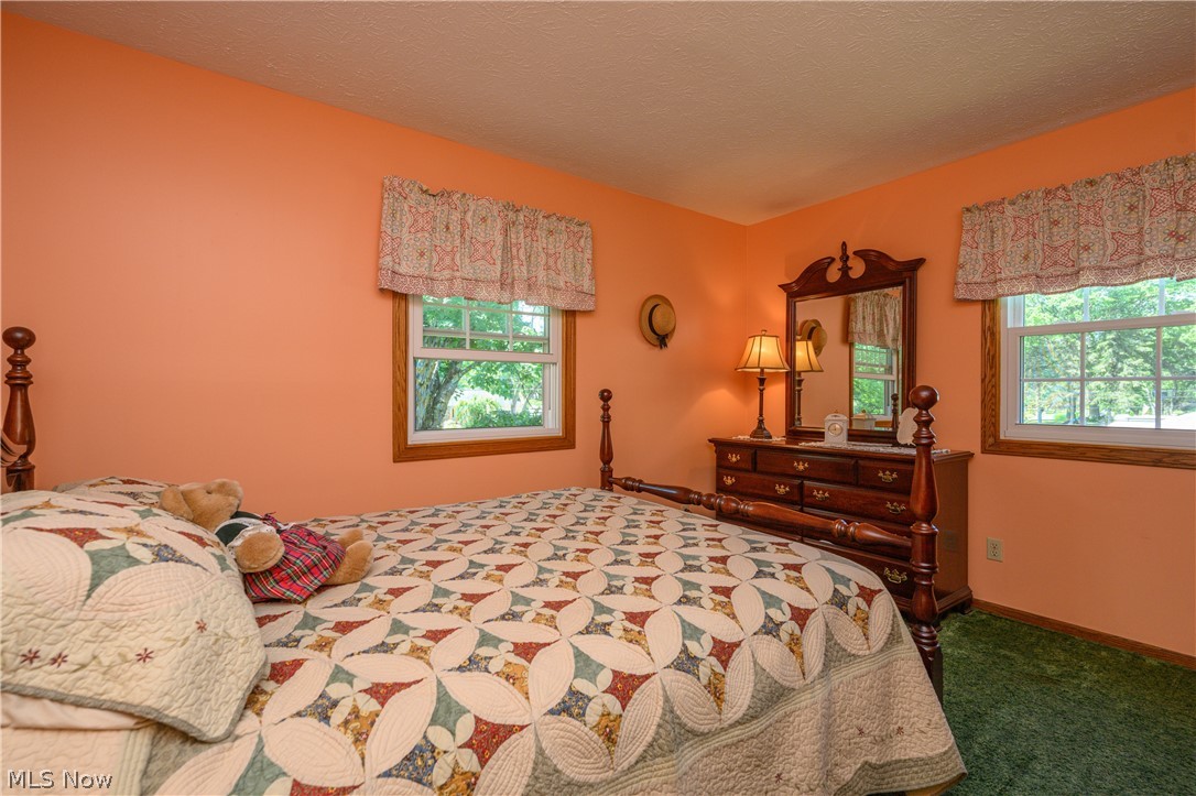 3281 Brenner Road Barberton, OH 44203 - Photo 29 of 33 Carpeted bedroom with a textured ceiling
