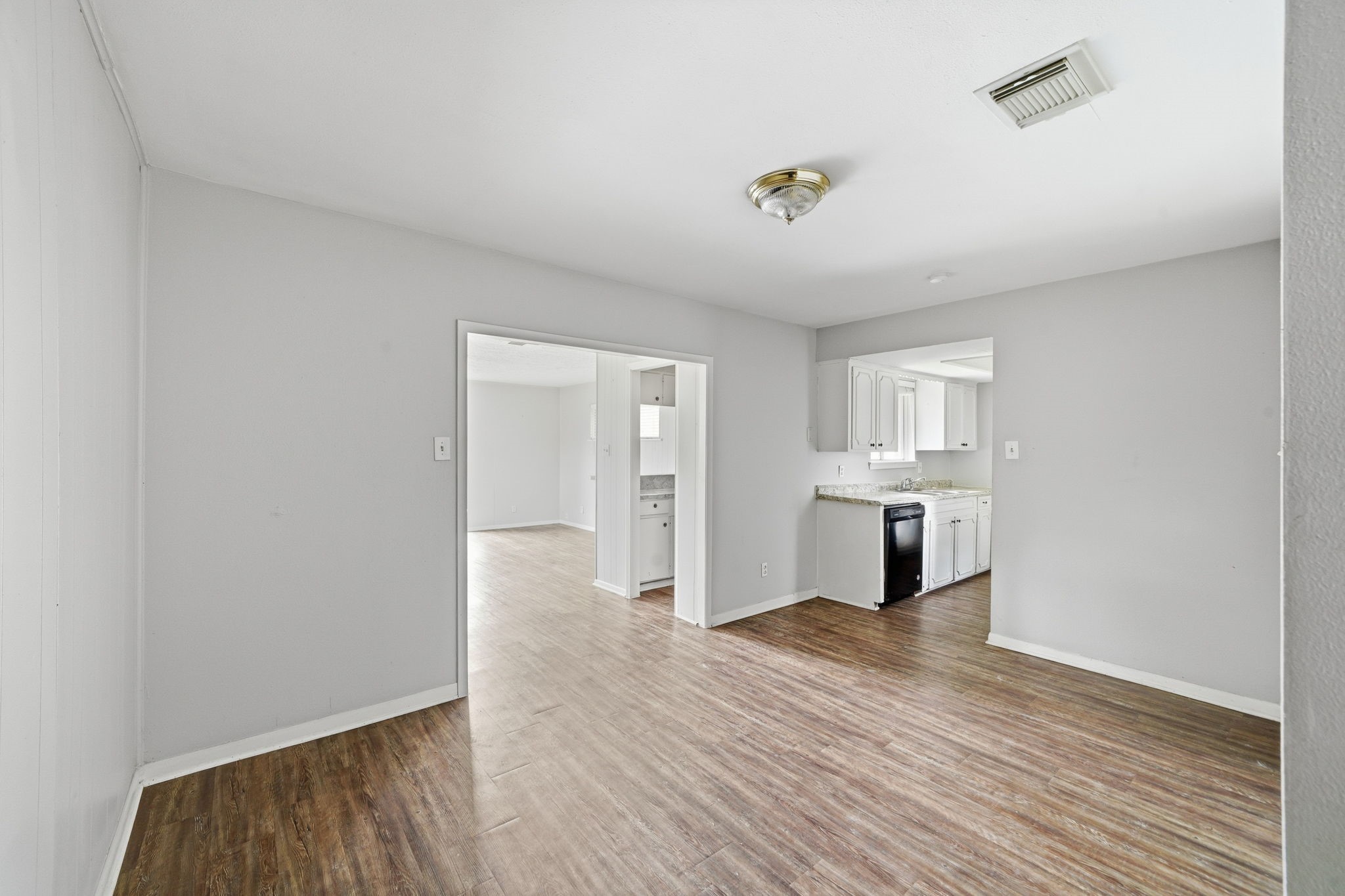6410 Hopper Road Houston, TX 77016 - Photo 12 of 28 a view of a kitchen with wooden floor