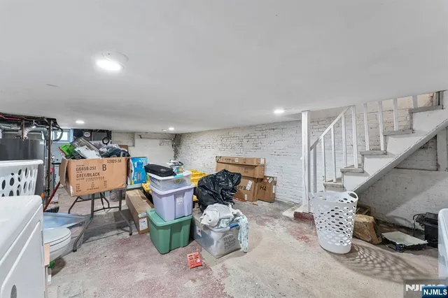 a dining room with furniture and a chandelier
