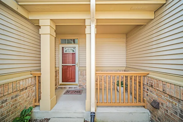 a view of a door and a window