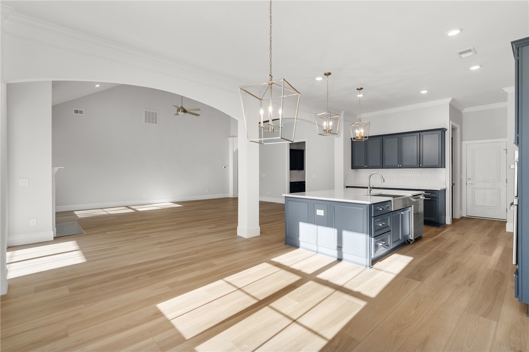 141 Rickys Path Easley, SC 29642 - Photo 15 of 40 Bright, open concept living and kitchen areas with wide plank wood floors create an inviting atmosphere.