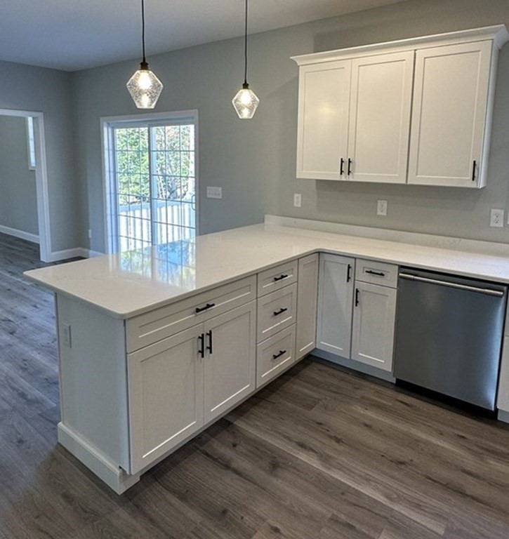 38 Juniper Road Ashburnham, MA 01430 - Photo 15 of 19 a kitchen with cabinets and wooden floor