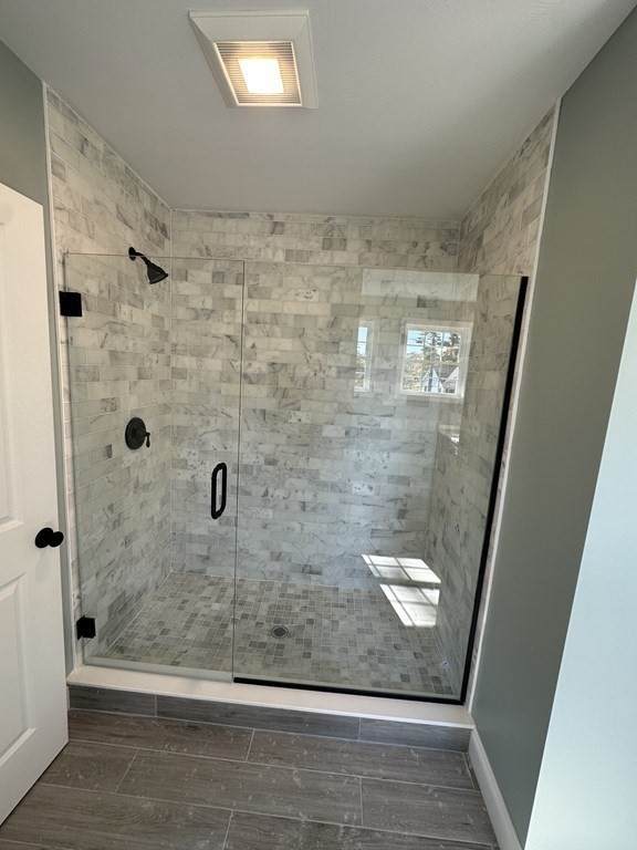 38 Juniper Road Ashburnham, MA 01430 - Photo 17 of 19 a bathroom with a glass shower door