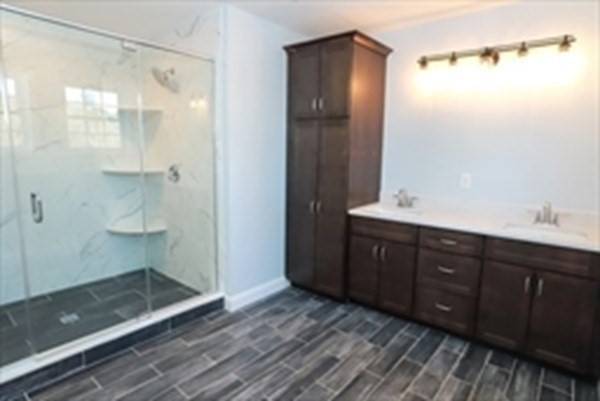 38 Juniper Road Ashburnham, MA 01430 - Photo 18 of 19 a bathroom with a glass shower door and a sink