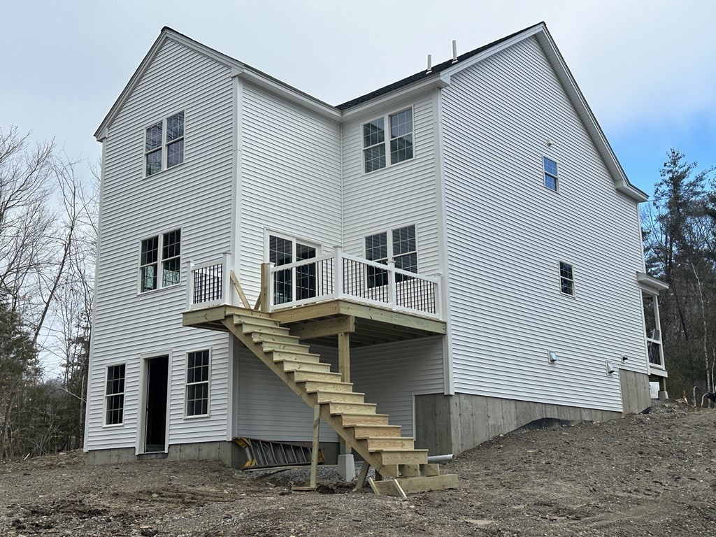 38 Juniper Road Ashburnham, MA 01430 - Photo 2 of 19 a view of a white house with large windows