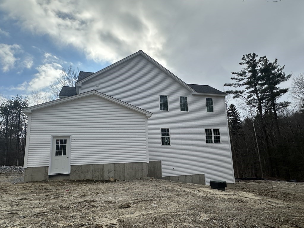 38 Juniper Road Ashburnham, MA 01430 - Photo 4 of 19 a view of a white house with a yard