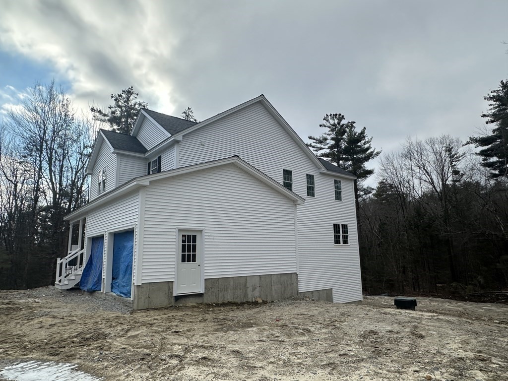 38 Juniper Road Ashburnham, MA 01430 - Photo 8 of 19 a view of a house with a yard