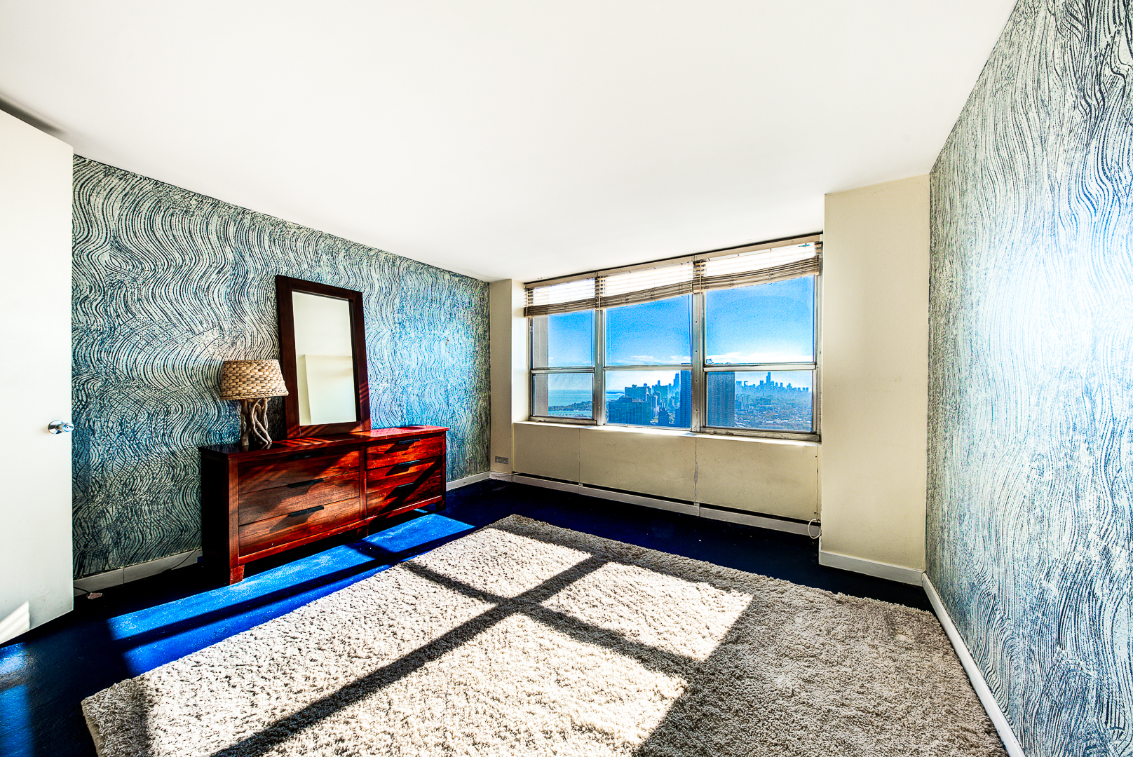 655 West Irving Park Road, Unit 3817 Chicago, IL 60613 - Photo 13 of 28 a living room with furniture and a rug