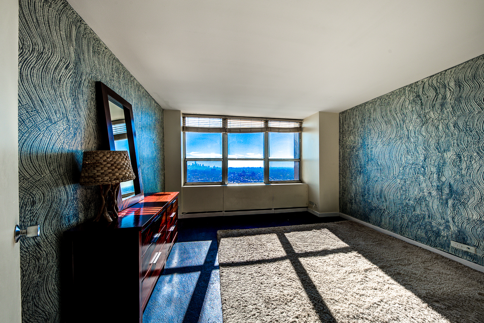 655 West Irving Park Road, Unit 3817 Chicago, IL 60613 - Photo 14 of 28 a living room with a couch and a window