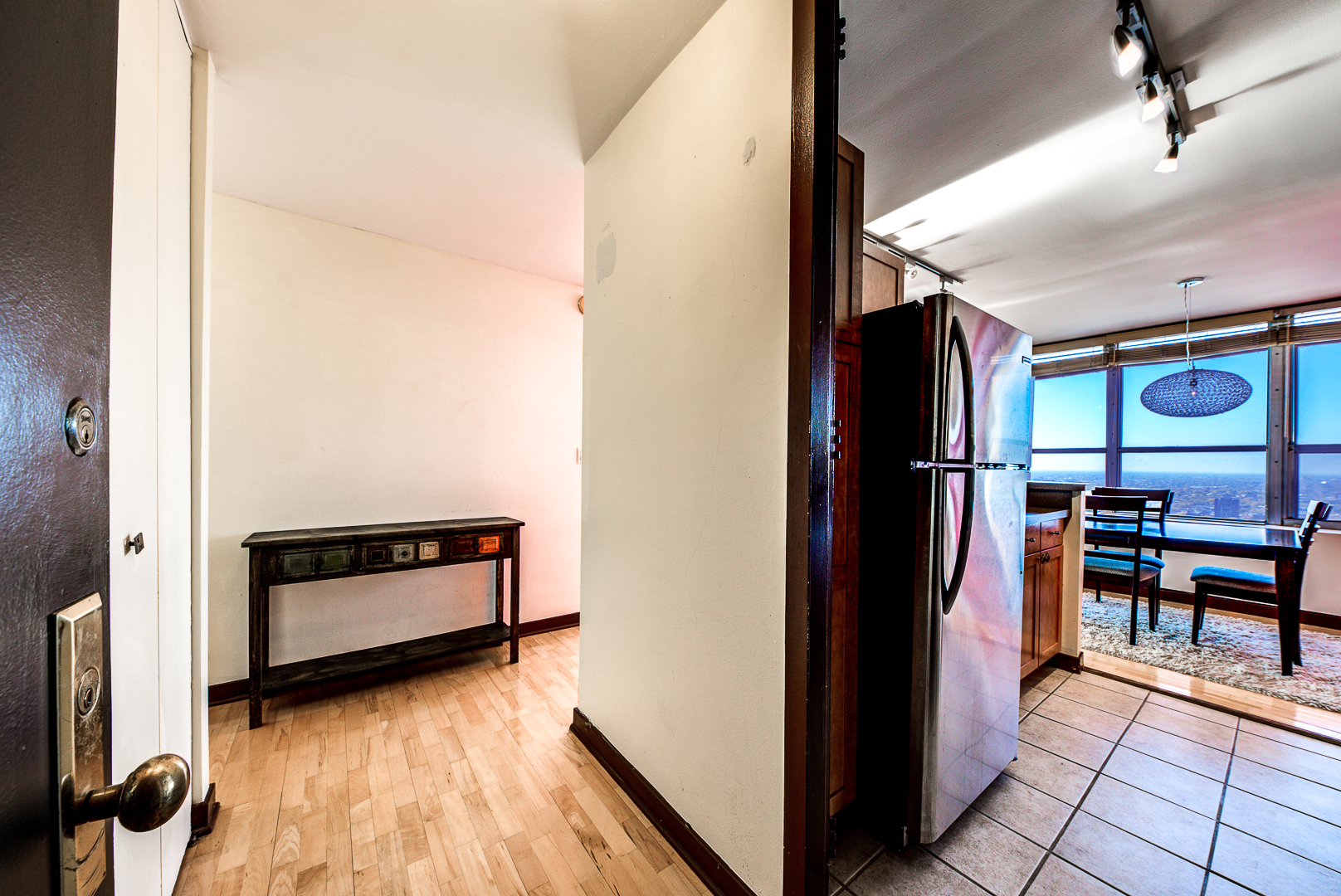 655 West Irving Park Road, Unit 3817 Chicago, IL 60613 - Photo 17 of 28 a view of dining room with furniture and a window