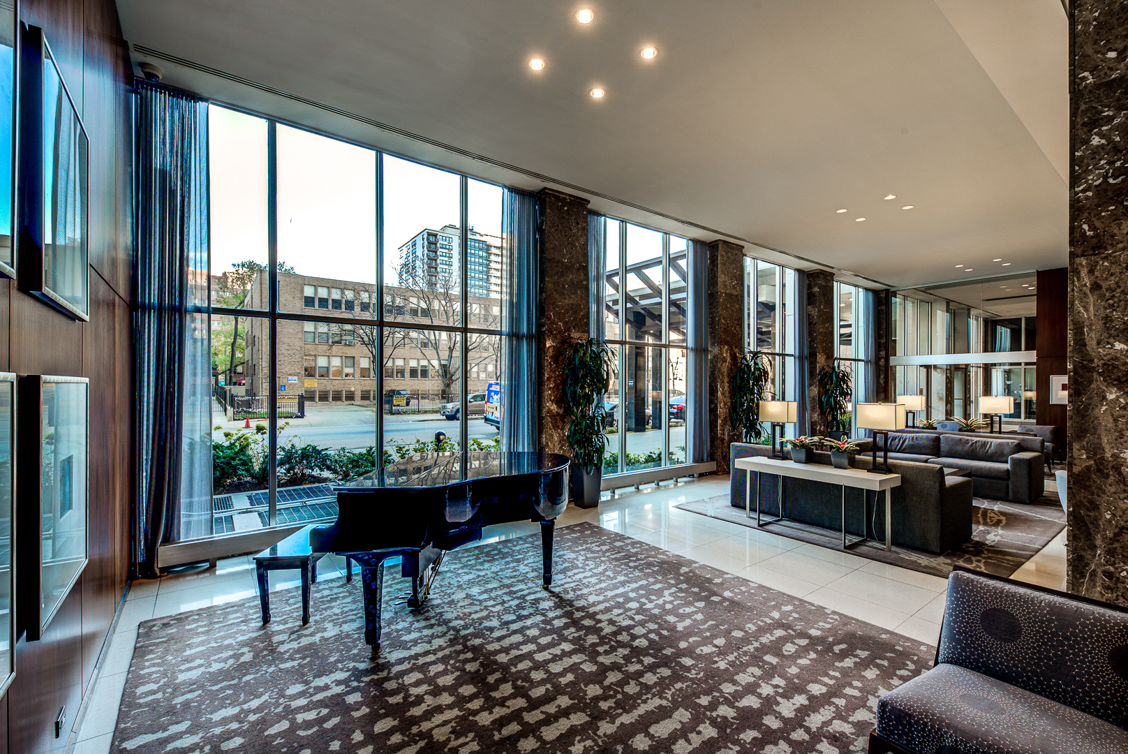 655 West Irving Park Road, Unit 3817 Chicago, IL 60613 - Photo 21 of 28 a living room with furniture and a floor to ceiling window