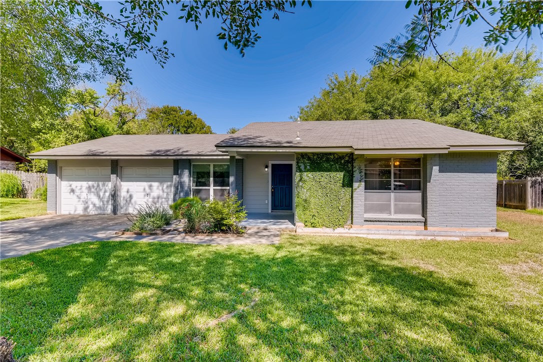 7212 South Brook Drive Austin, TX 78736 - Photo 1 of 1 a front view of a house with a garden and yard