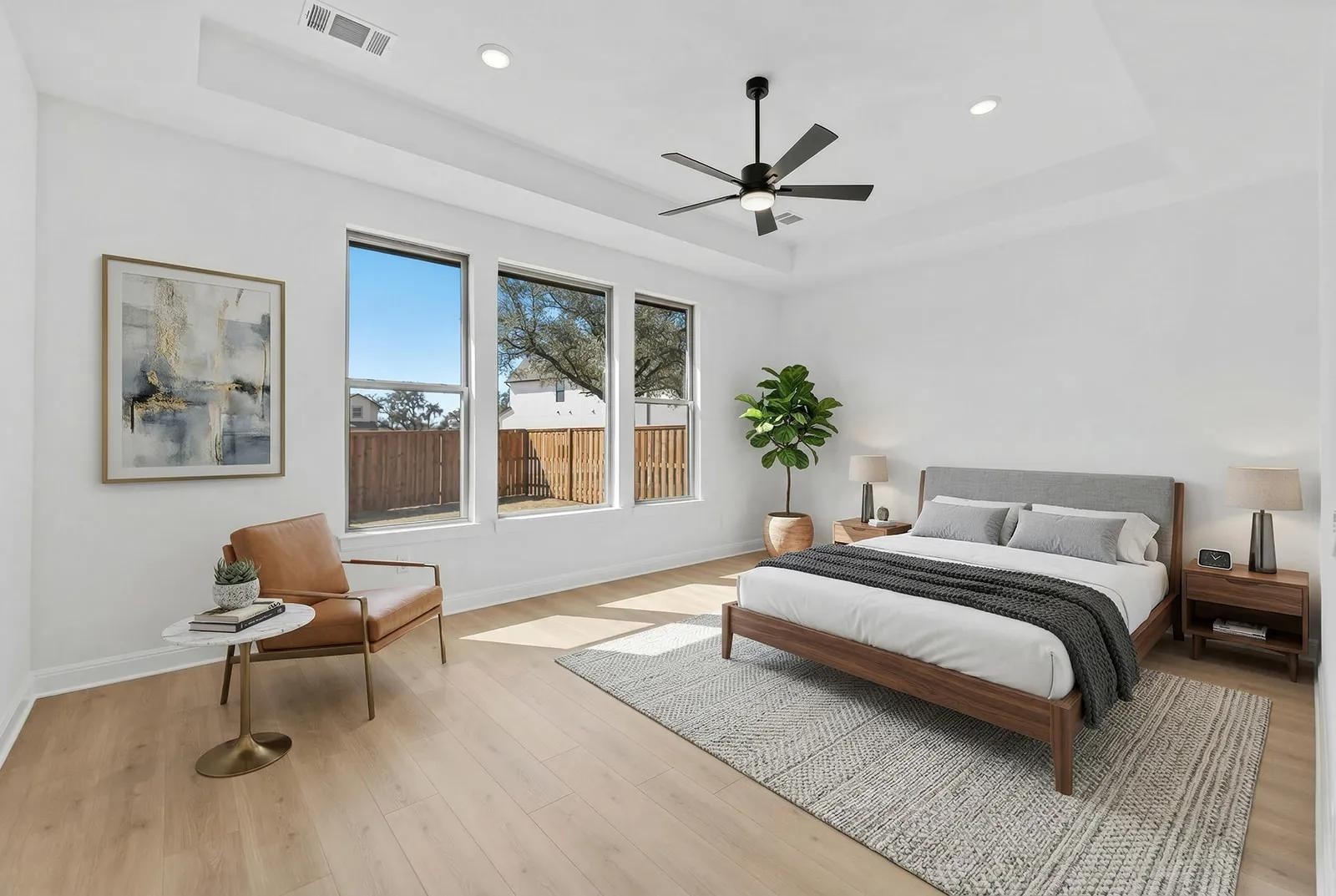 308 Buckaroo Drive Georgetown, TX 78633 - Photo 10 of 31 a spacious bedroom with a bed a chandelier and a window
