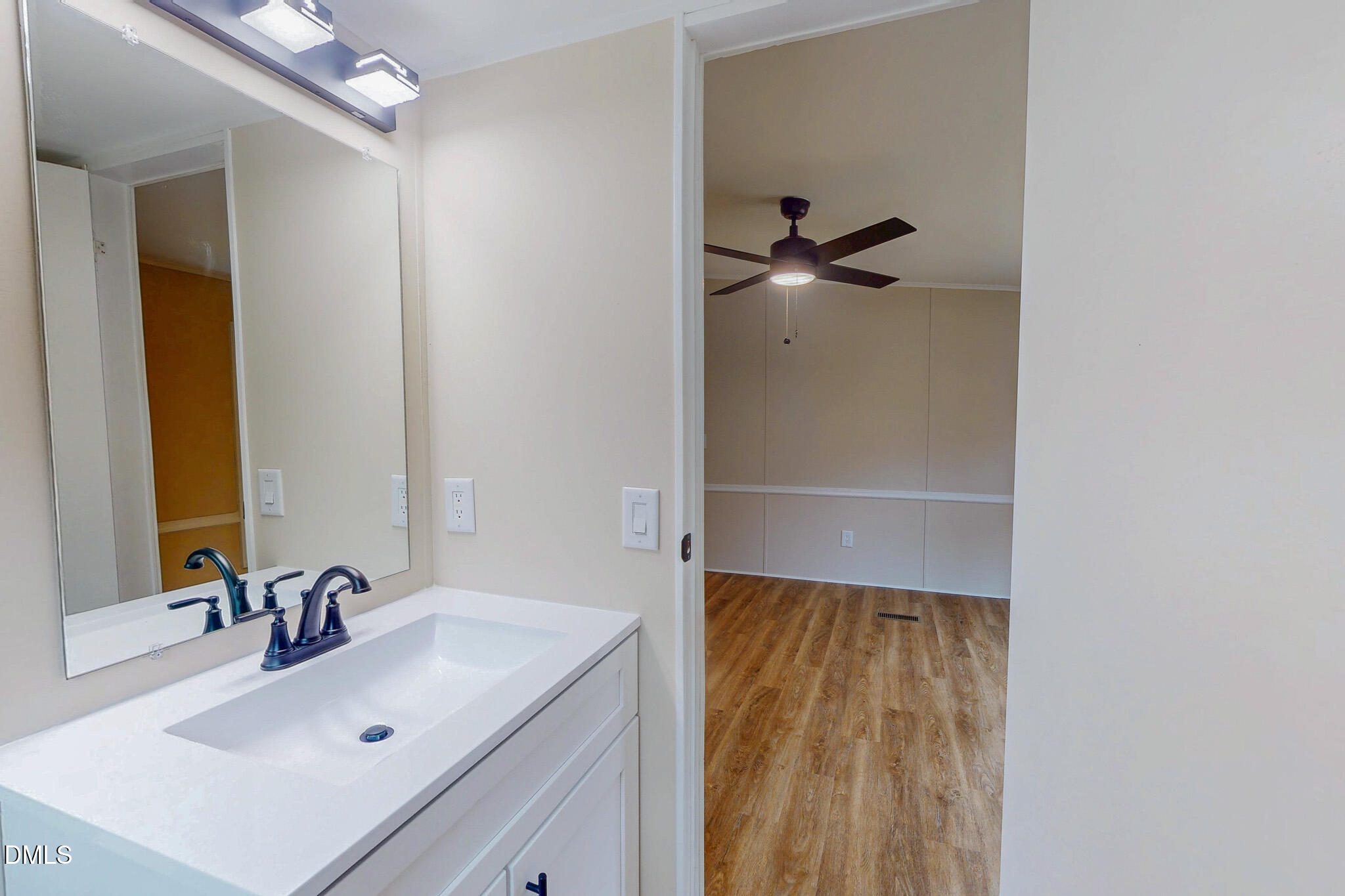 67 Halifax Road Roxboro, NC 27574 - Photo 19 of 48 a bathroom with a sink and mirror