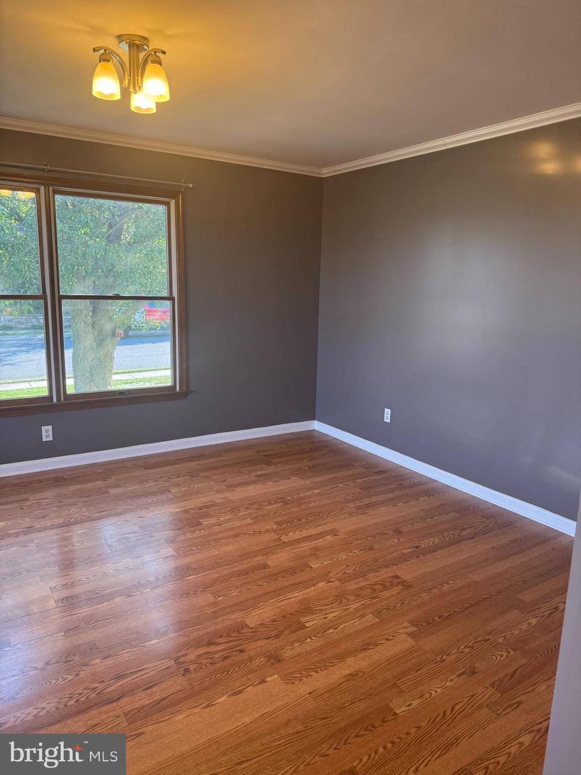 3312 Scotland Road Chambersburg, PA 17202 - Photo 8 of 32 an empty room with wooden floor and windows