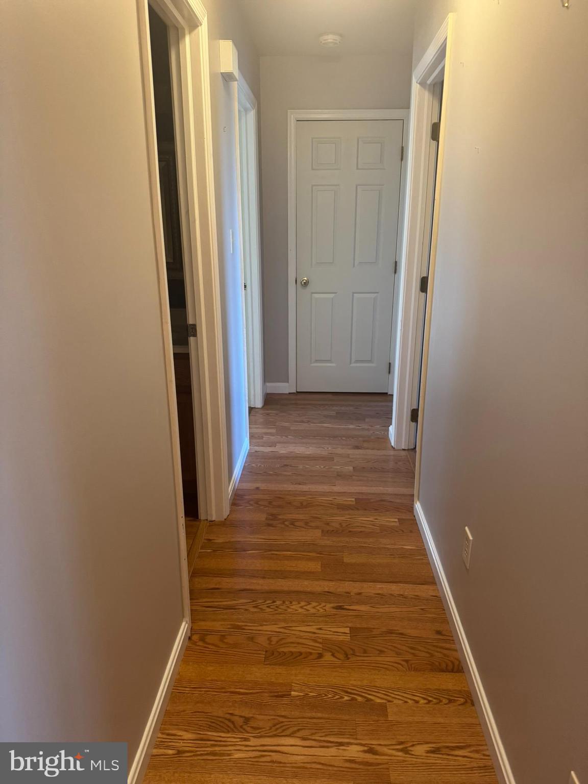 3312 Scotland Road Chambersburg, PA 17202 - Photo 9 of 32 a view of a hallway with wooden floor and a bathroom