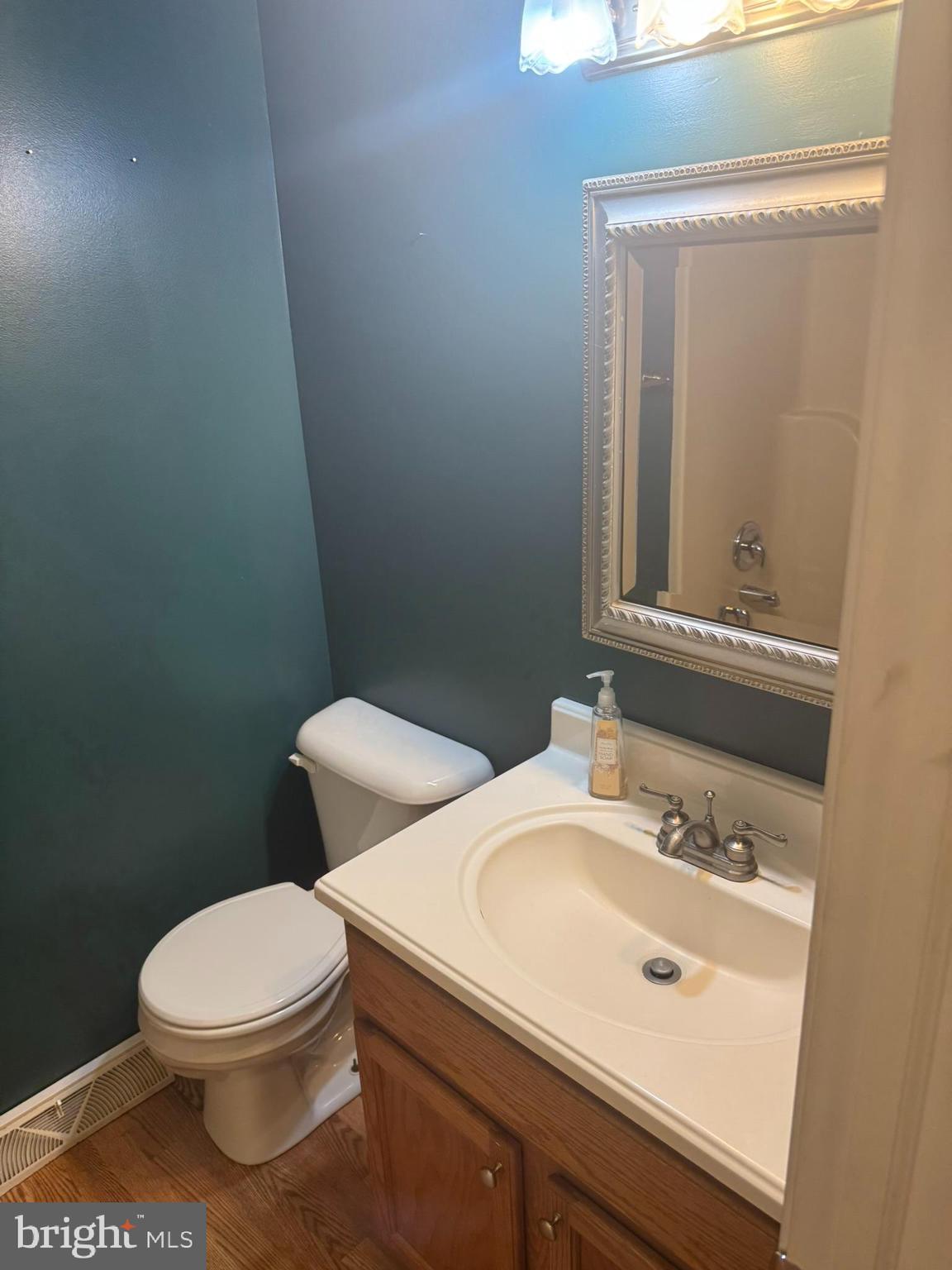 3312 Scotland Road Chambersburg, PA 17202 - Photo 10 of 32 a bathroom with a sink a toilet and mirror