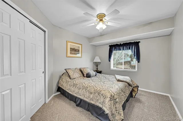 a spacious bathroom with double vanity and a bathtub