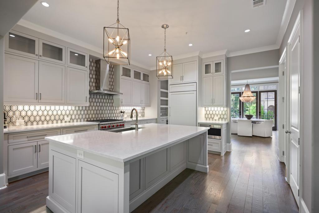 5980 Teton Way Atlanta, GA 30328 - Photo 13 of 48 a kitchen with sink a stove and cabinets