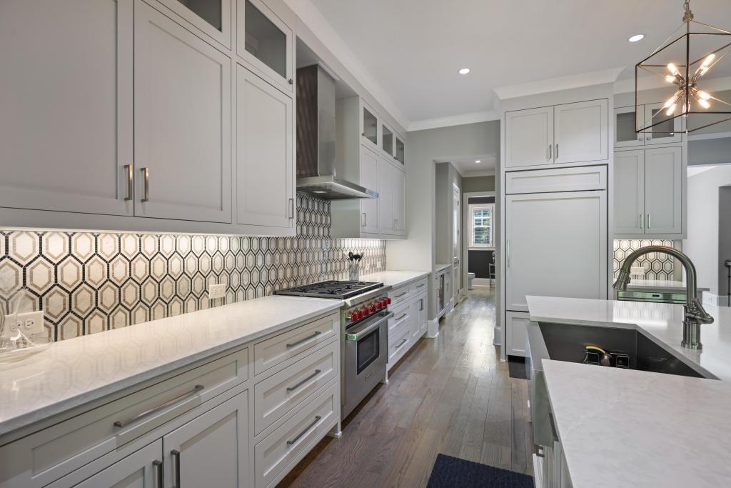5980 Teton Way Atlanta, GA 30328 - Photo 14 of 48 a kitchen with stainless steel appliances granite countertop a stove a sink and a refrigerator