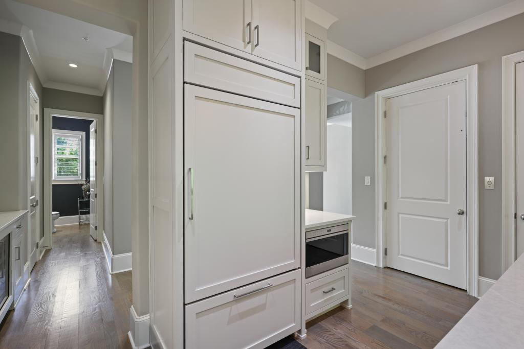 5980 Teton Way Atlanta, GA 30328 - Photo 15 of 48 a view of hallway with stairs and wooden floor