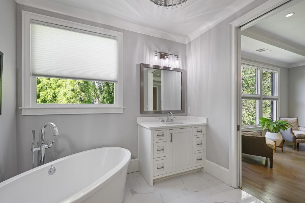 5980 Teton Way Atlanta, GA 30328 - Photo 20 of 48 a bathroom with a tub a sink and a window