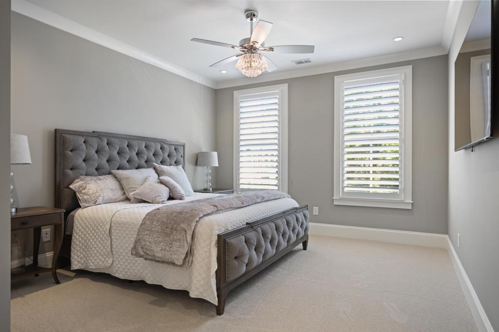 5980 Teton Way Atlanta, GA 30328 - Photo 24 of 48 a bed sitting in a bedroom next to a window