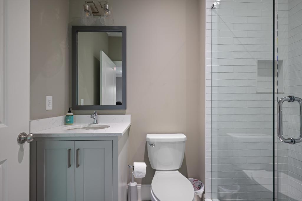 5980 Teton Way Atlanta, GA 30328 - Photo 26 of 48 a bathroom with a toilet sink and mirror