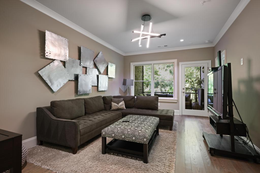 5980 Teton Way Atlanta, GA 30328 - Photo 30 of 48 a living room with furniture and a flat screen tv