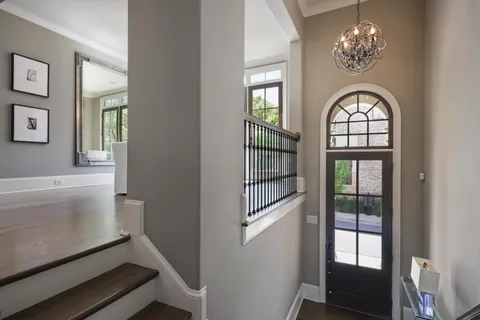 a view of an entryway with wooden floor
