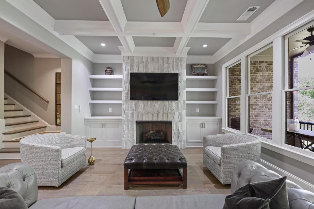 5980 Teton Way Atlanta, GA 30328 - Photo 10 of 48 a living room with furniture a flat screen tv and a fireplace