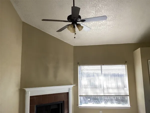 a window with a ceiling fan