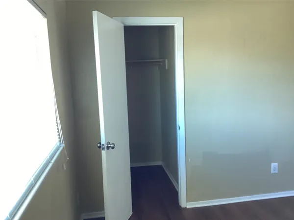 a view of front door with wooden floor