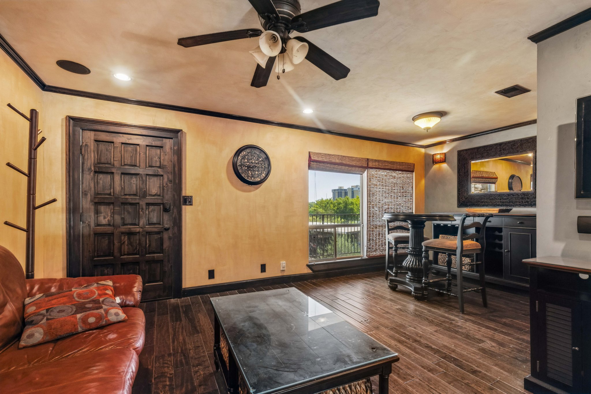 500 East Riverside Drive, Unit 254 Austin, TX 78704 - Photo 2 of 10 Rich hardwood floors complement a private balcony, offering serene outdoor living space.