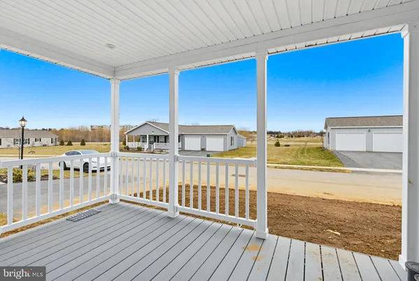 a view of a balcony with wooden floor